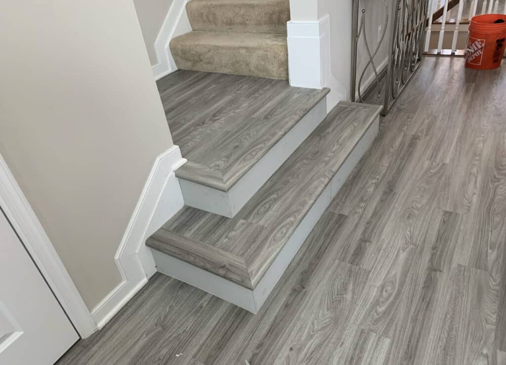 luxury vinyl floor bending gray vinyl on stair landing