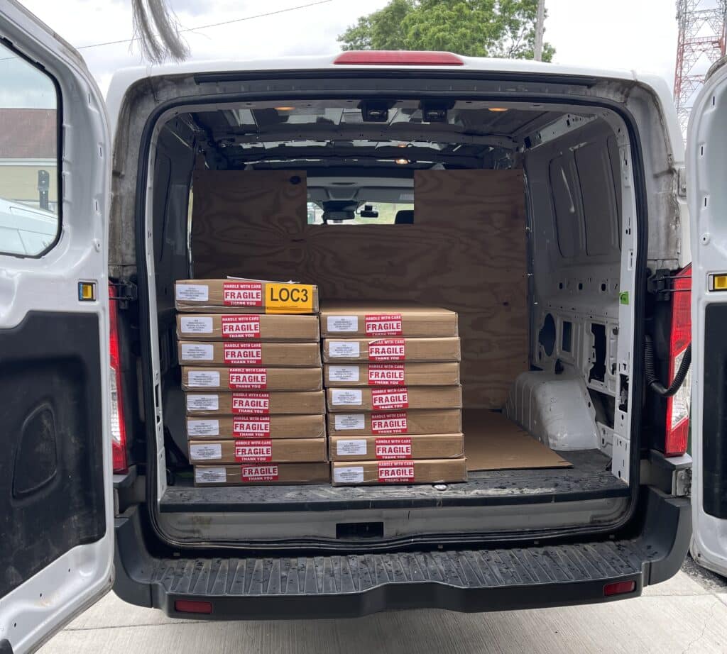 pallets of luxury vinyl flooring in a delivery van